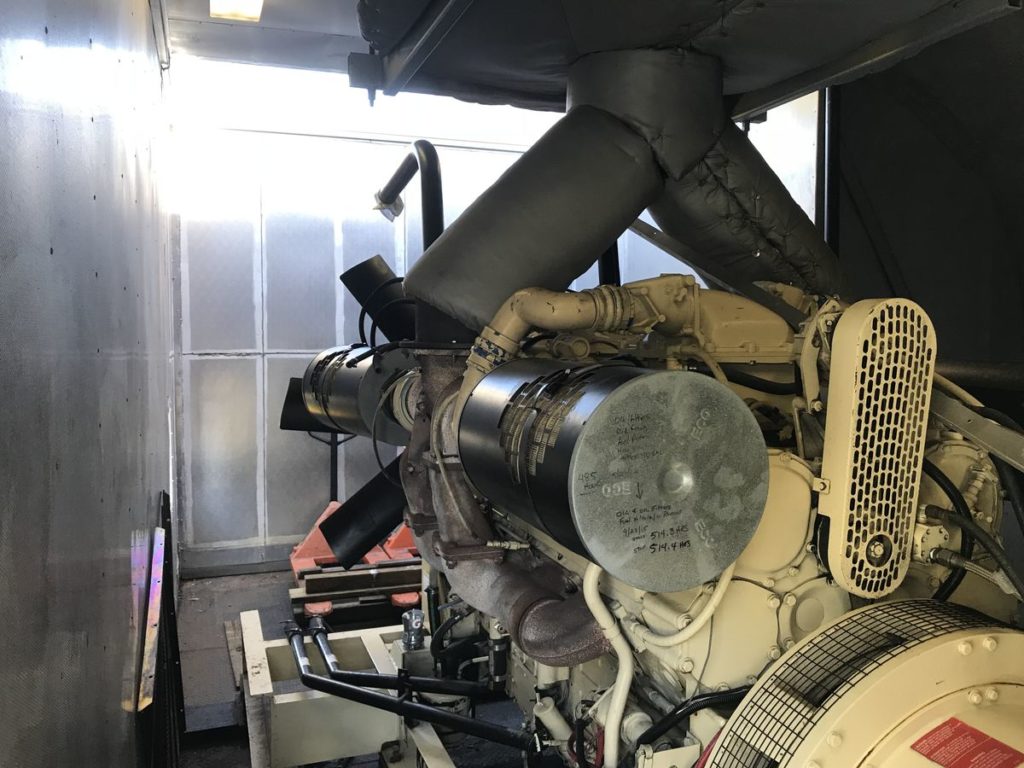Rear view of generator inside enclosure